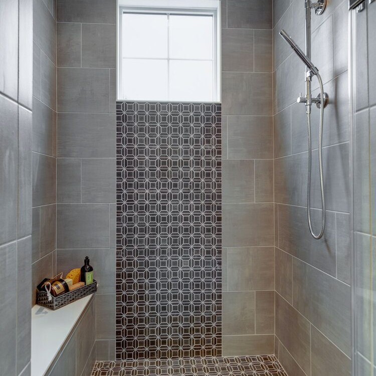A custom bathroom with a tiled floor.