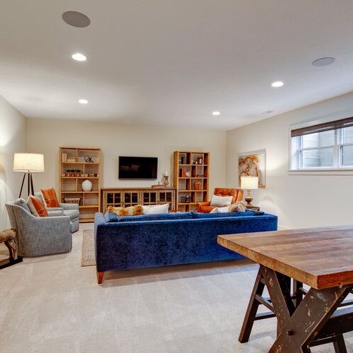 A living room with a table and chairs in a new home construction in Indianapolis, Indiana.