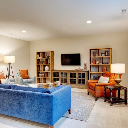 A living room with a new blue couch and a TV in Carmel, Indiana.