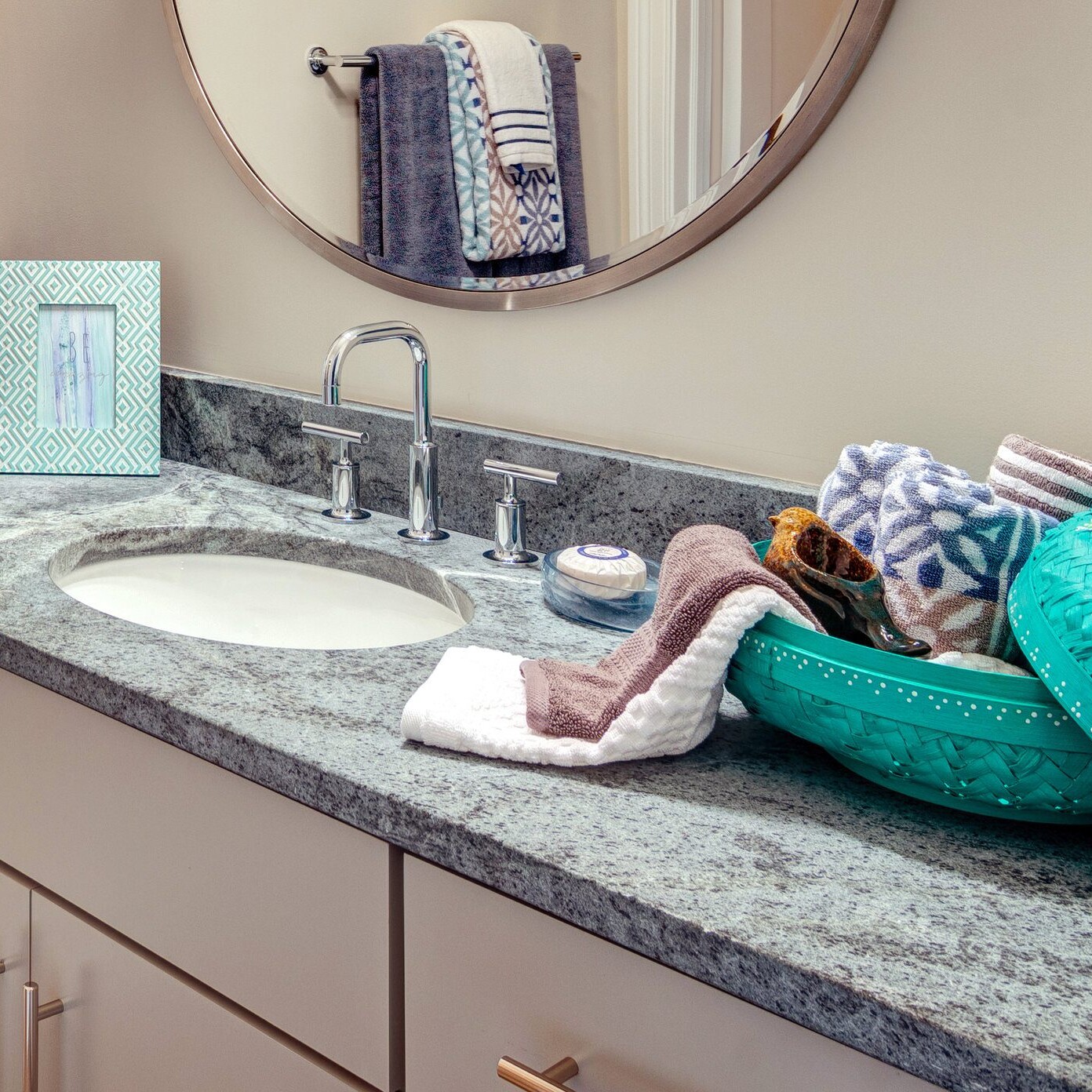 A bathroom with a sink and a mirror, perfect for your custom home in Carmel, Indiana.