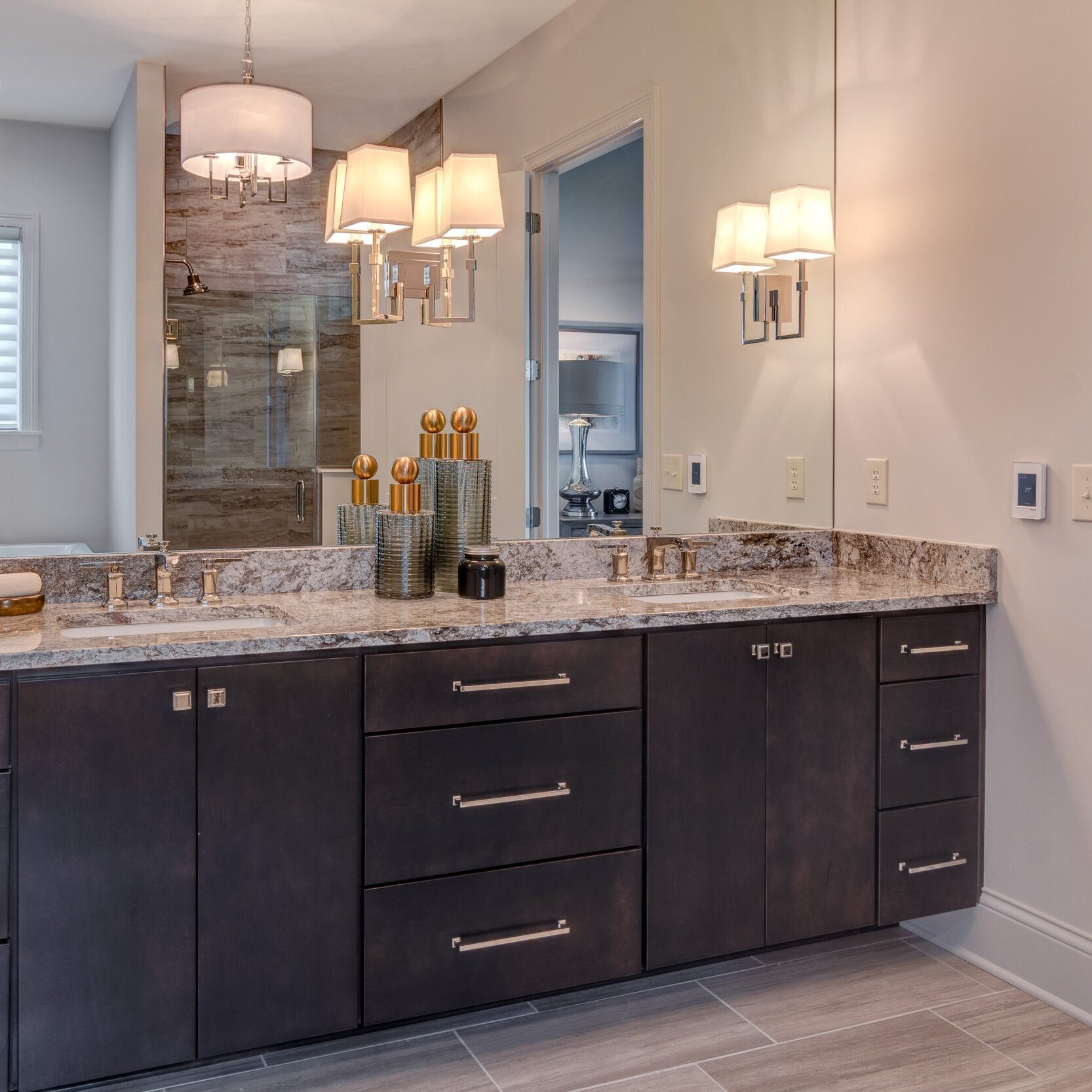 A bathroom with two sinks and a mirror in a new home construction in Indianapolis.