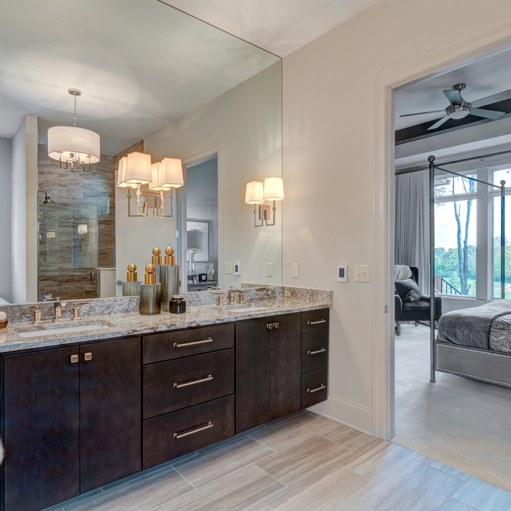 A bathroom with two sinks and a large mirror in a new home construction.