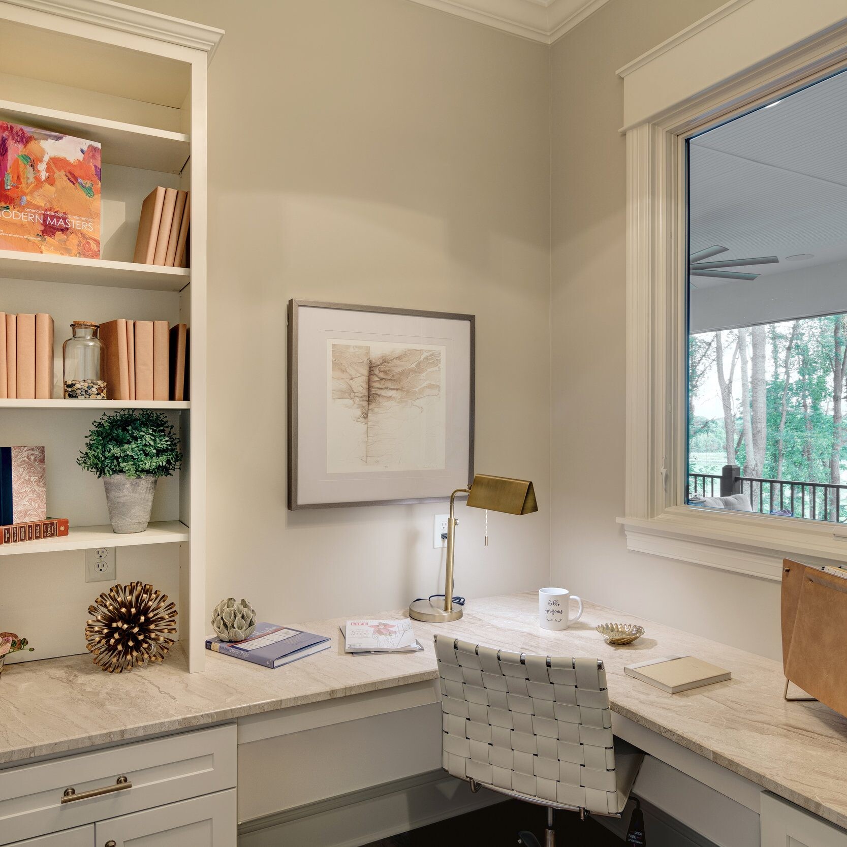 A custom home office with bookshelves and a window, built by a reputable custom home builder in Carmel, Indiana.