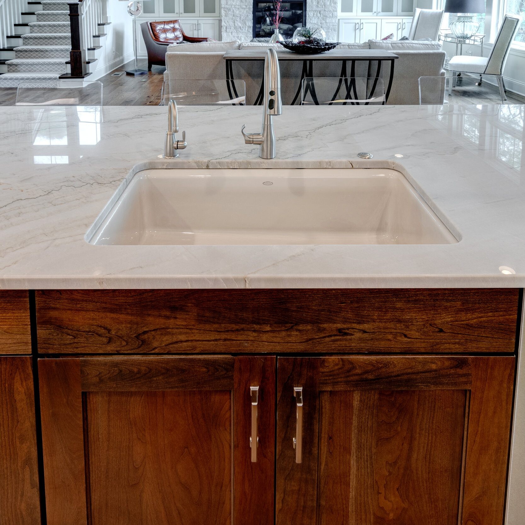 A custom home builder in Carmel, Indiana offers new home construction with a kitchen featuring a luxurious marble counter top.
