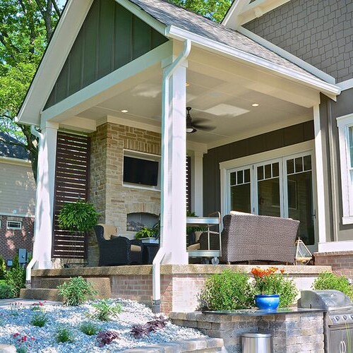 A new home with a front porch and patio located in Indianapolis.