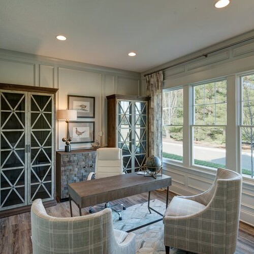 A home office with a desk and chair, perfect for new home construction in Indianapolis.