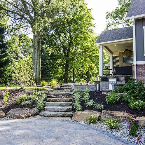 A new home with a stone walkway and landscaping in Carmel, Indiana.