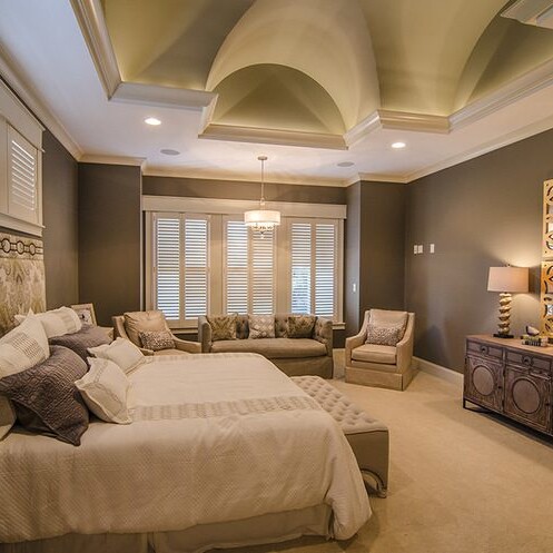 Custom master bedroom with vaulted ceiling in a new home construction.