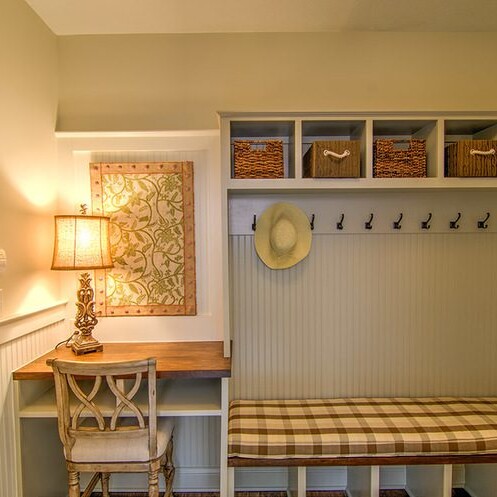 Custom mudroom with a bench and baskets.