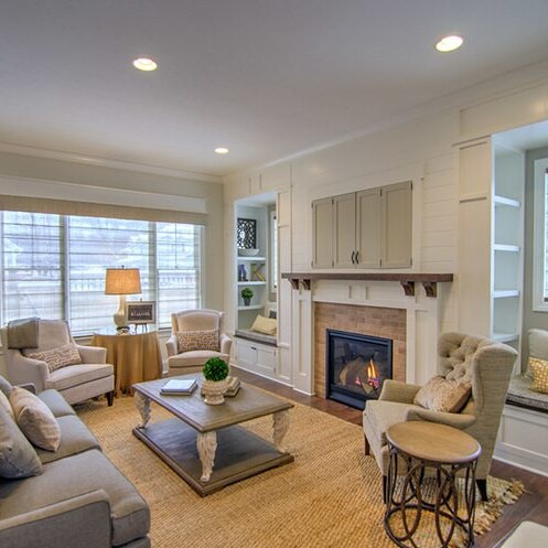 A cozy living room with comfortable couches and a warm fireplace, perfect for unwinding after a long day.