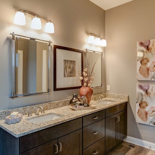 A custom bathroom in Indianapolis Indiana with two sinks and a mirror.