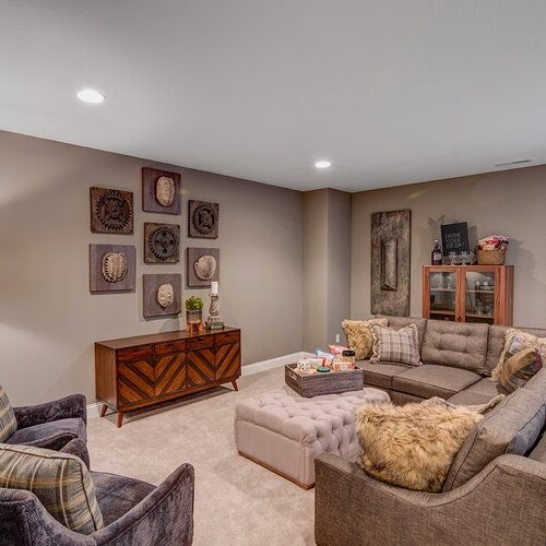 A living room with custom-built couches and a sleek coffee table.