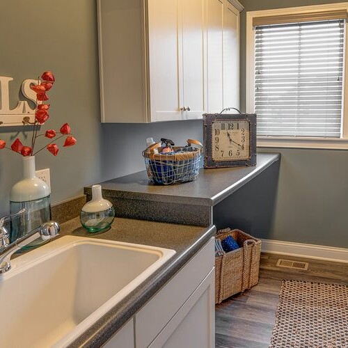 New homes for sale in Carmel Indiana featuring a laundry room with a sink and a washer and dryer.