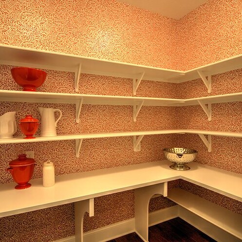 A pantry with shelves and vases in it, customized by a Custom Home Builder in Indianapolis Indiana.
