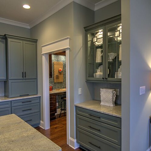 A kitchen with gray cabinets and a lamp, located in Fishers Indiana.