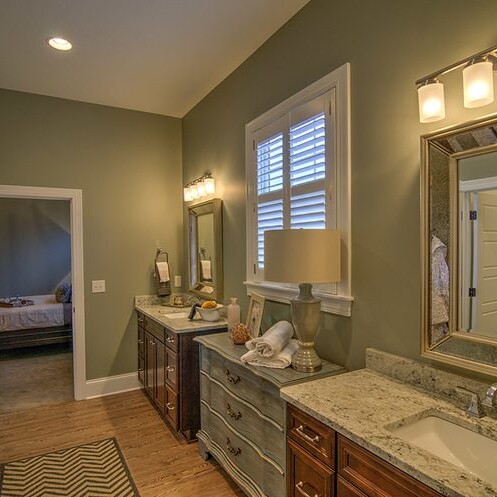 A luxury bathroom with two sinks and a mirror.