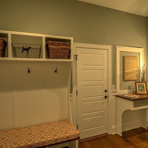 A mudroom with bench and storage, ideal for Fishers Indiana Custom Homes.