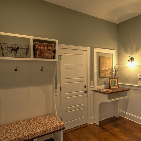 A mudroom with a bench and storage, custom-built by a luxury home builder in Carmel Indiana.