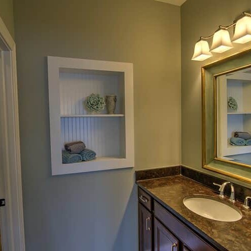 A modern bathroom complete with a sink and a mirror.