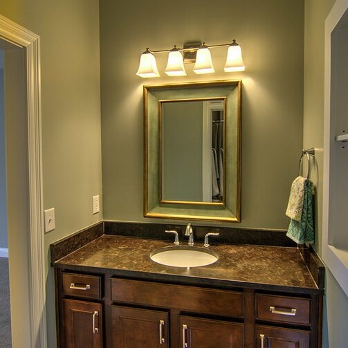 A luxurious bathroom with a sink and mirror.