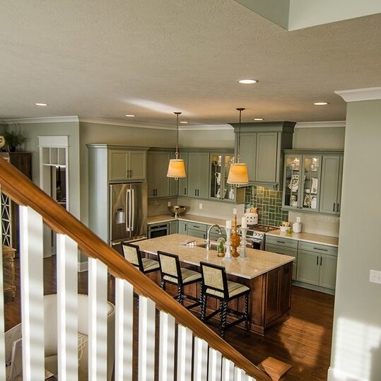 A stunning view of the kitchen and dining room in a luxury custom home, located conveniently near Carmel Indiana.
