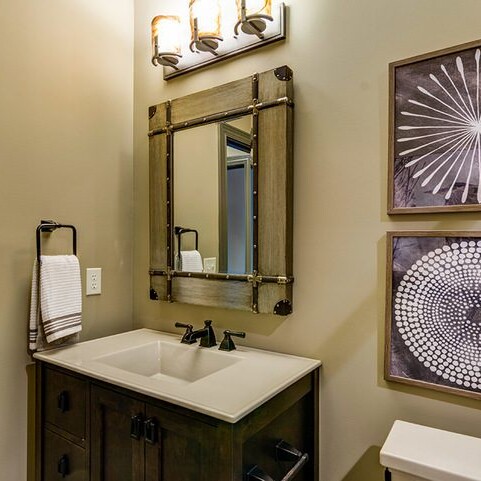 A bathroom with a luxurious sink and mirror.