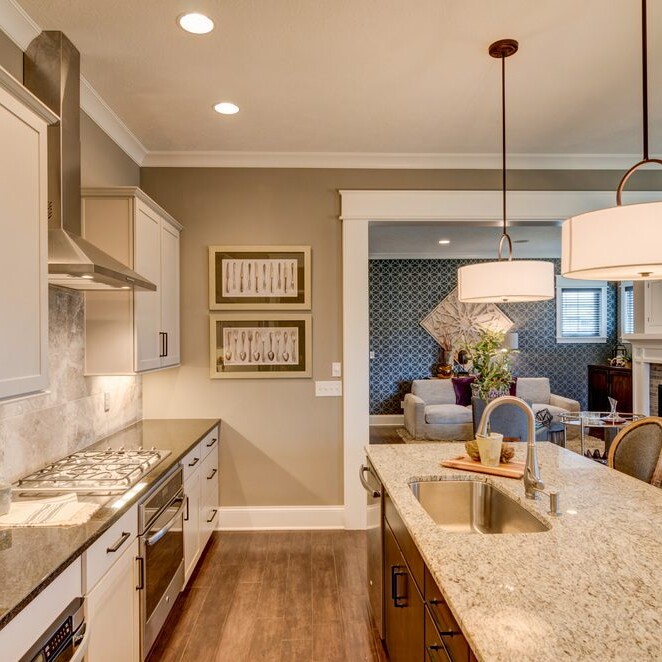 A custom home with granite counter tops and stainless steel appliances.