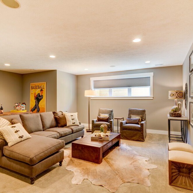 A luxurious living room furnished with custom couches and an elegant coffee table.
