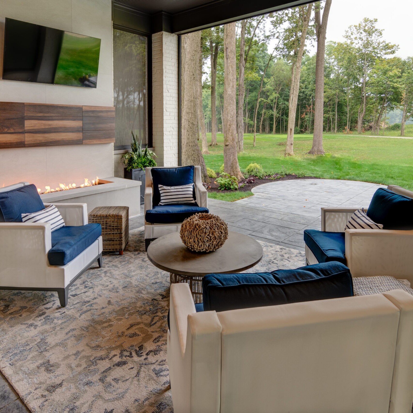 A living room with couches and a fireplace.