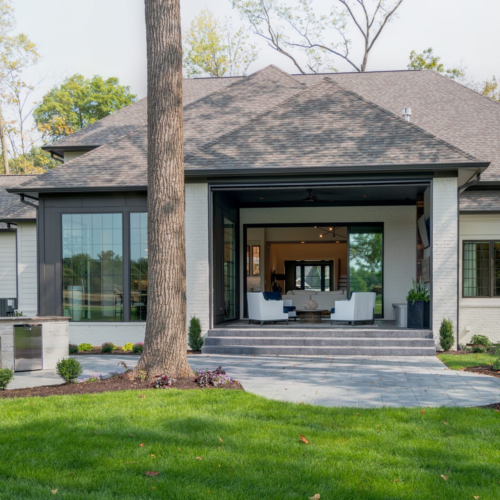 A home with a large patio and a fireplace.