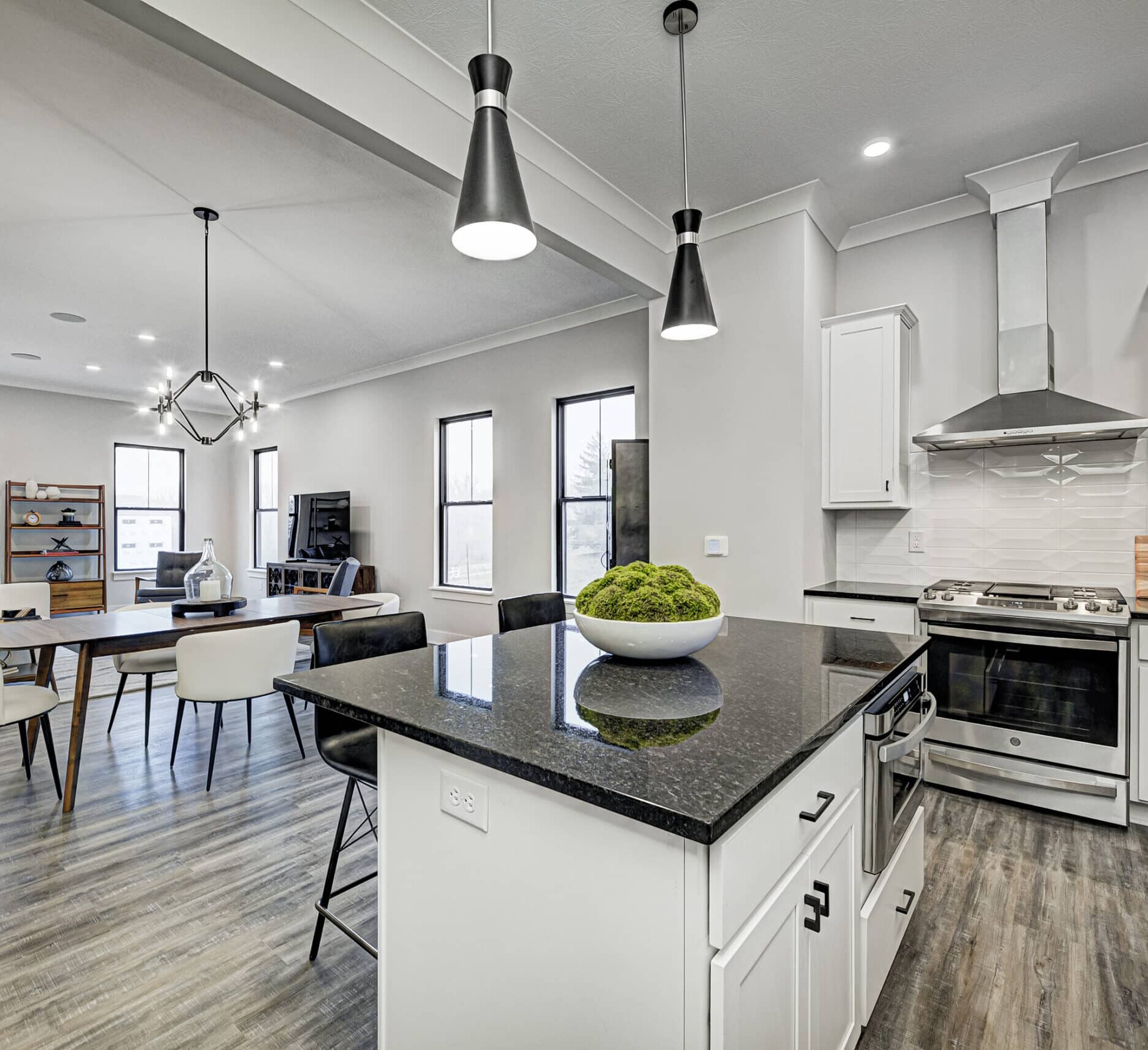An open kitchen with hardwood floors, perfect for Indianapolis Custom Homes and custom home builders in Fishers Indiana and Carmel Indiana.