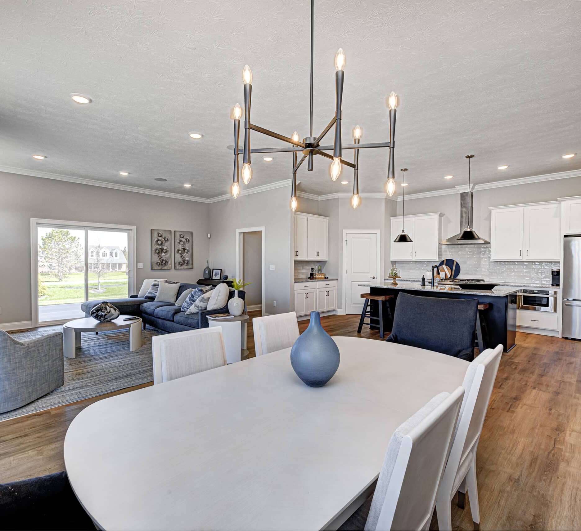 A new home featuring a living room and dining room, built by a custom home builder in Carmel, Indiana.