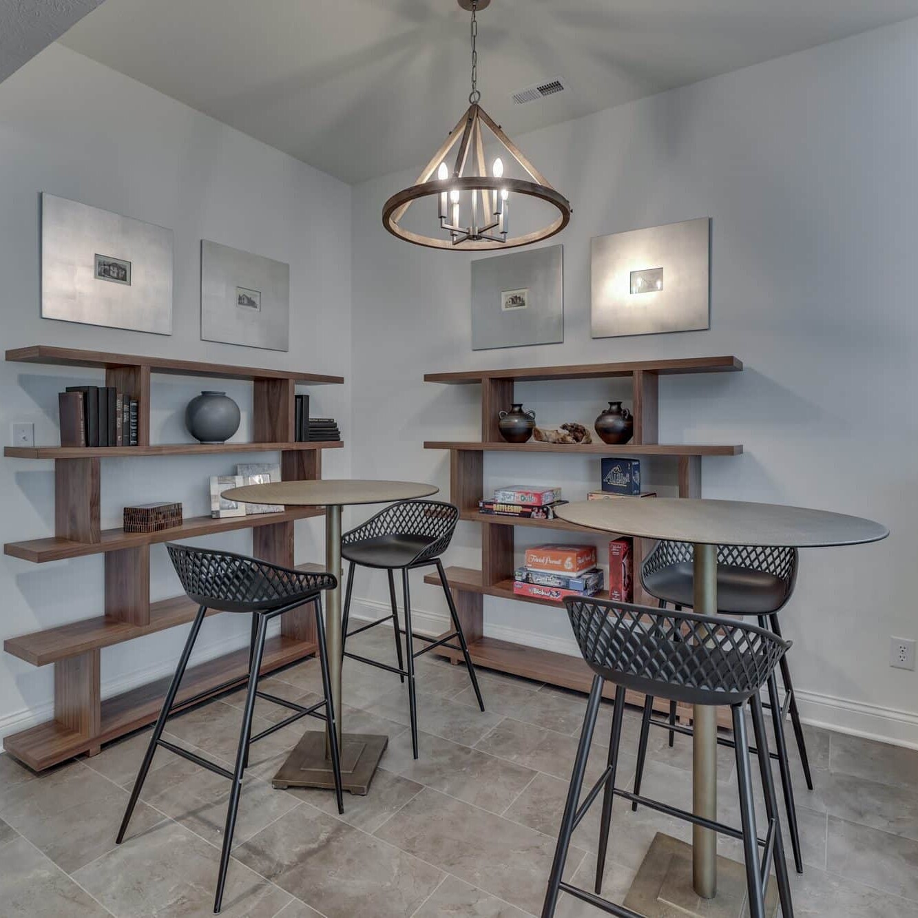 A living room with a bar and bookshelves.