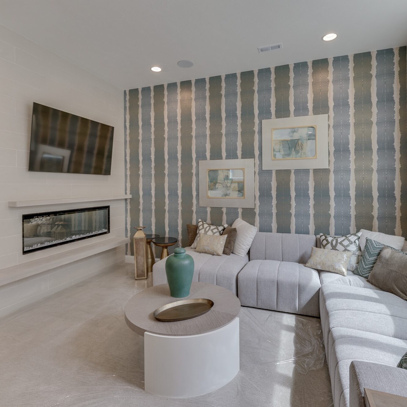 A living room with a tv and a fireplace.