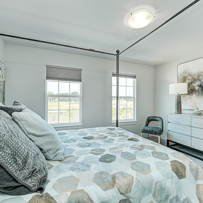 A four poster bed in a bedroom.