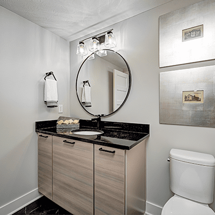 A bathroom with a toilet and a sink.