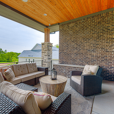 Wicker furniture on the porch.