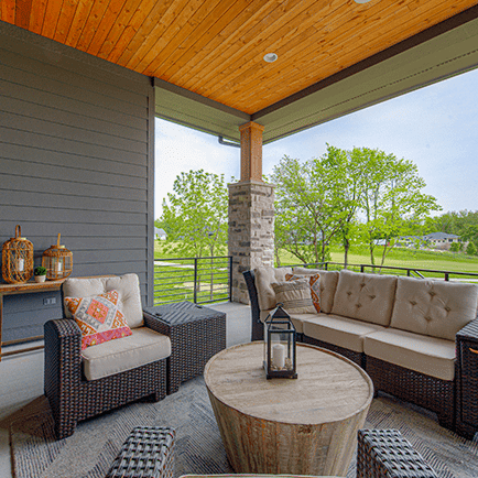 Wicker furniture on the porch.