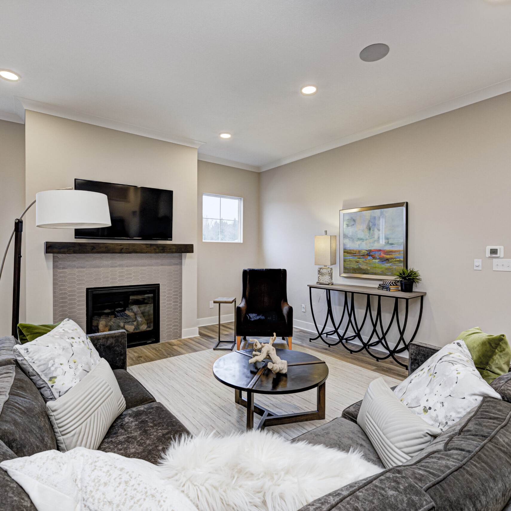 A custom-built living room in Fishers, Indiana with cozy couches and a warm fireplace.