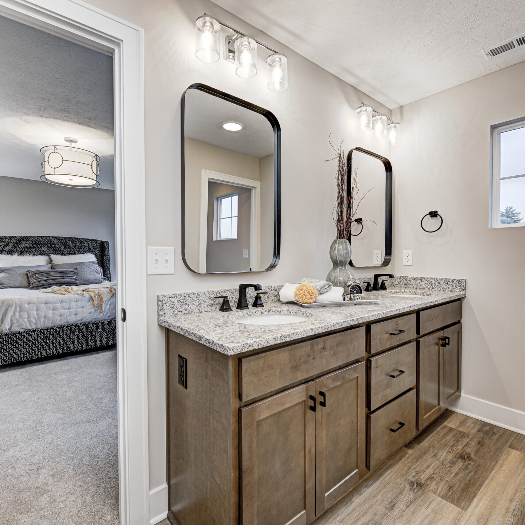 A custom bathroom with two sinks and a mirror.