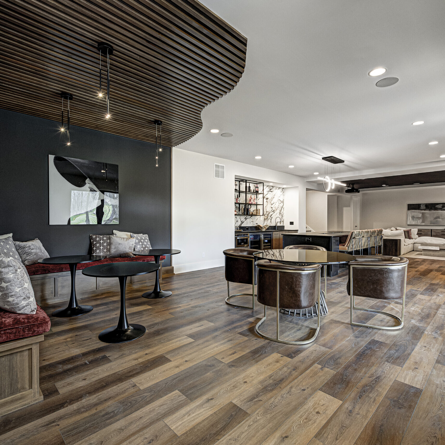 A living room with wood floors and a fireplace.