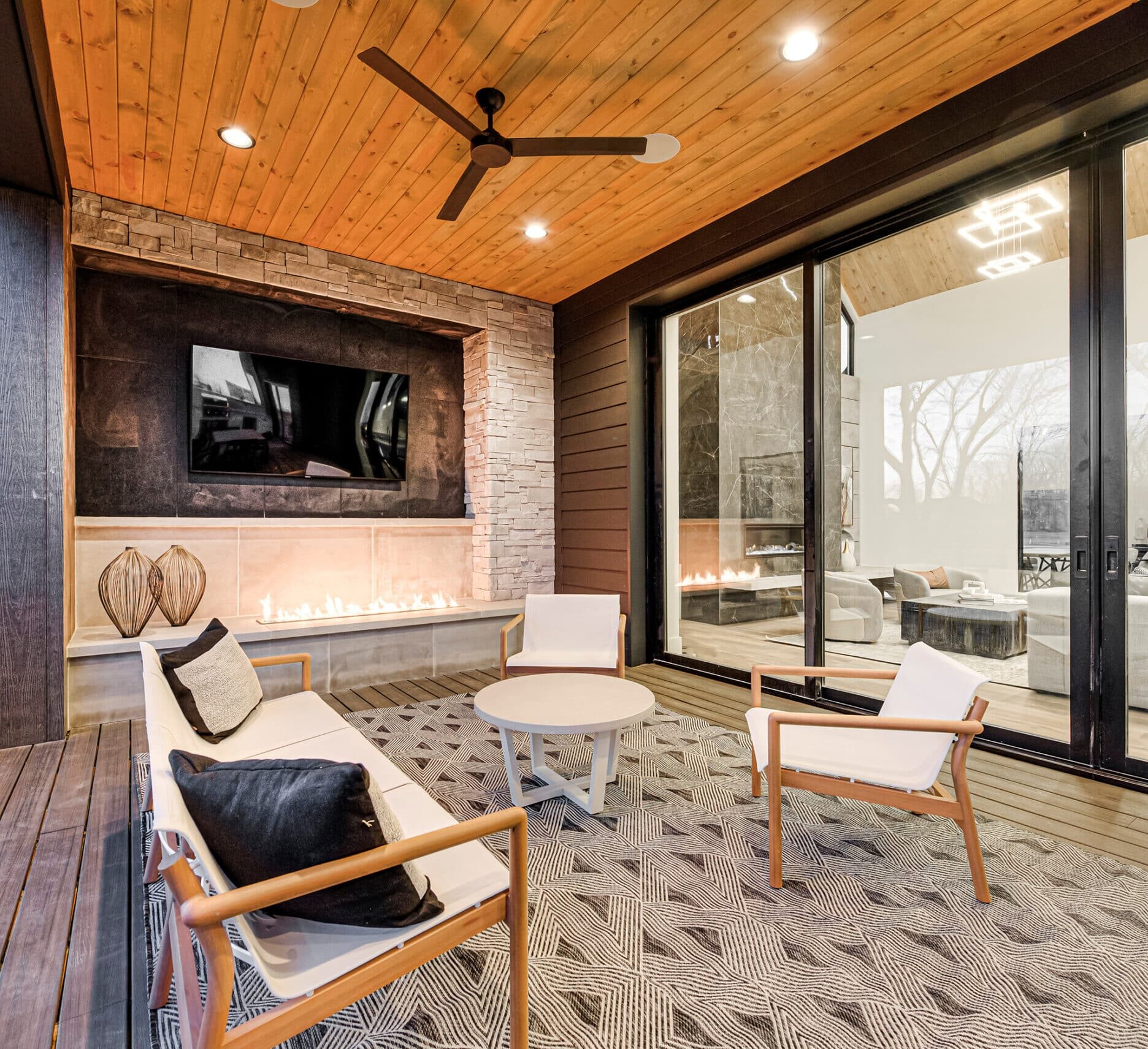 A modern living room with a fireplace and tv.