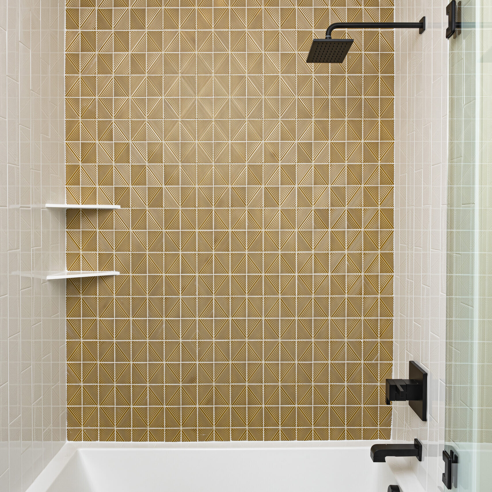 A bathroom with tiled walls and a bathtub.