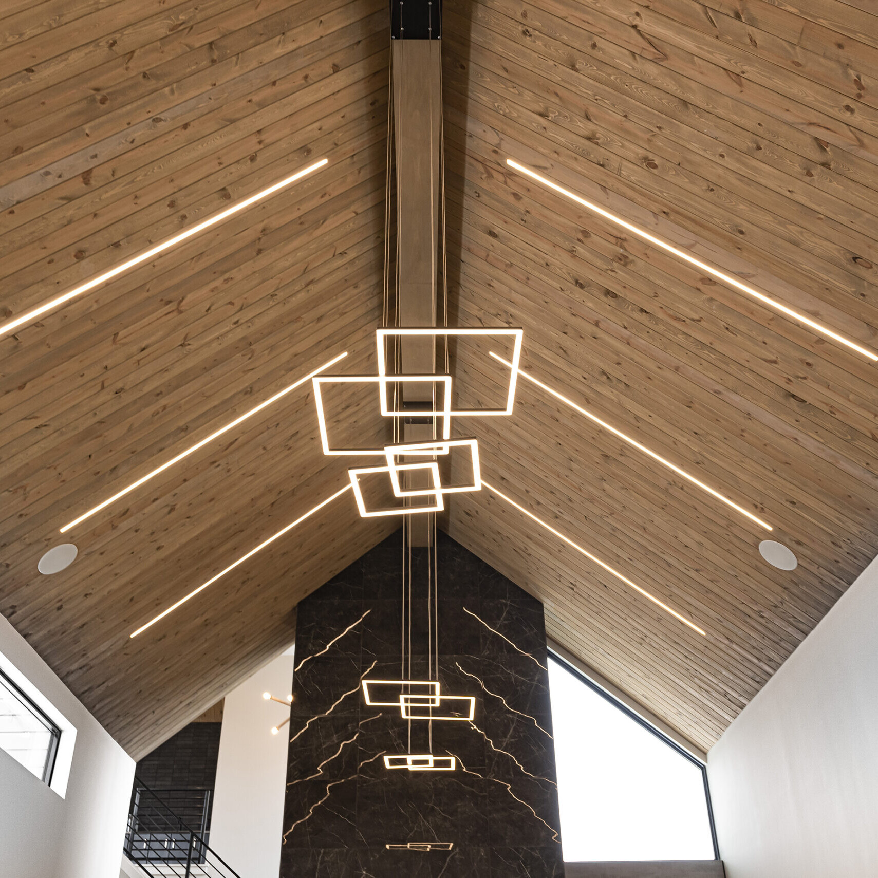 The ceiling of a building with wooden beams.