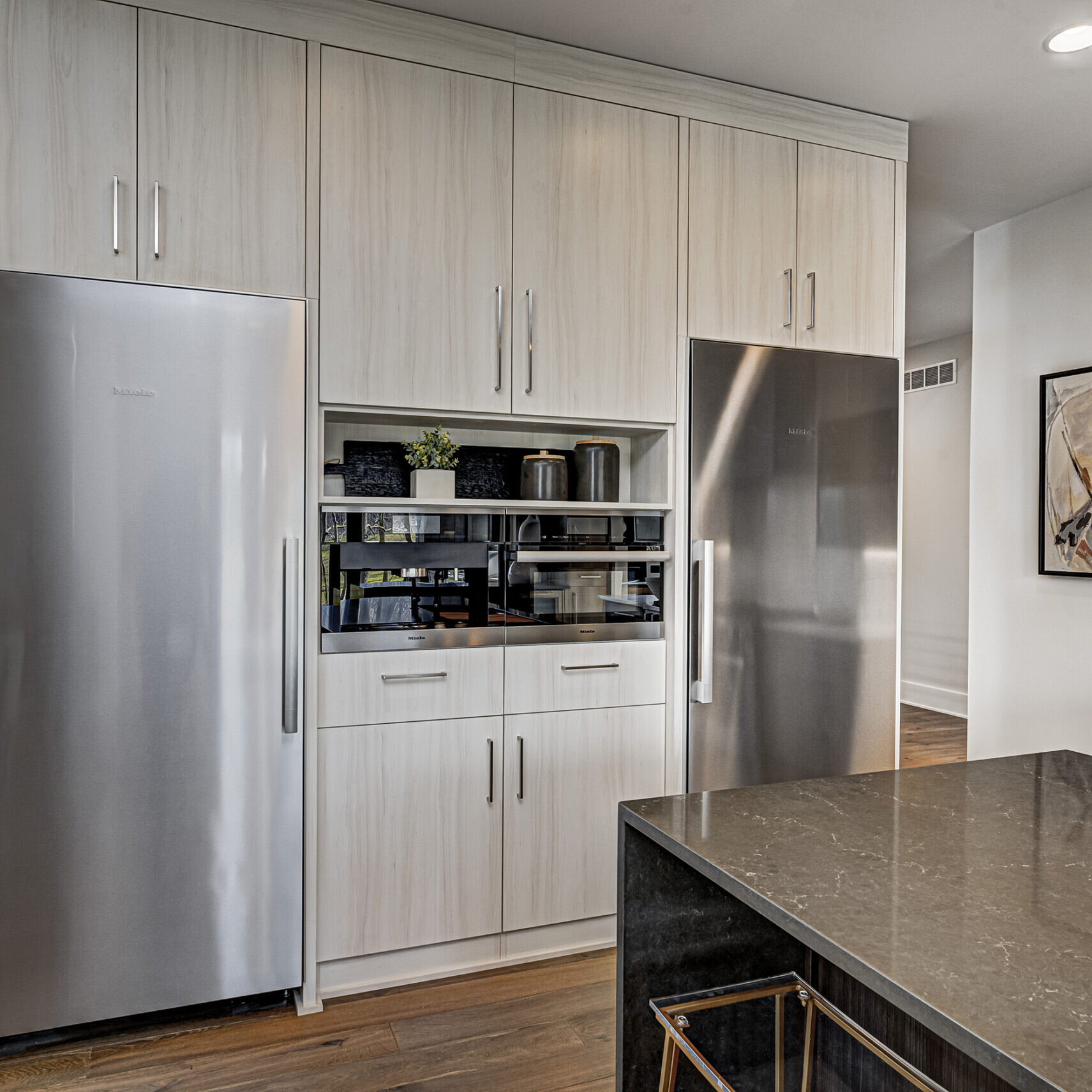 A modern kitchen with stainless steel appliances.