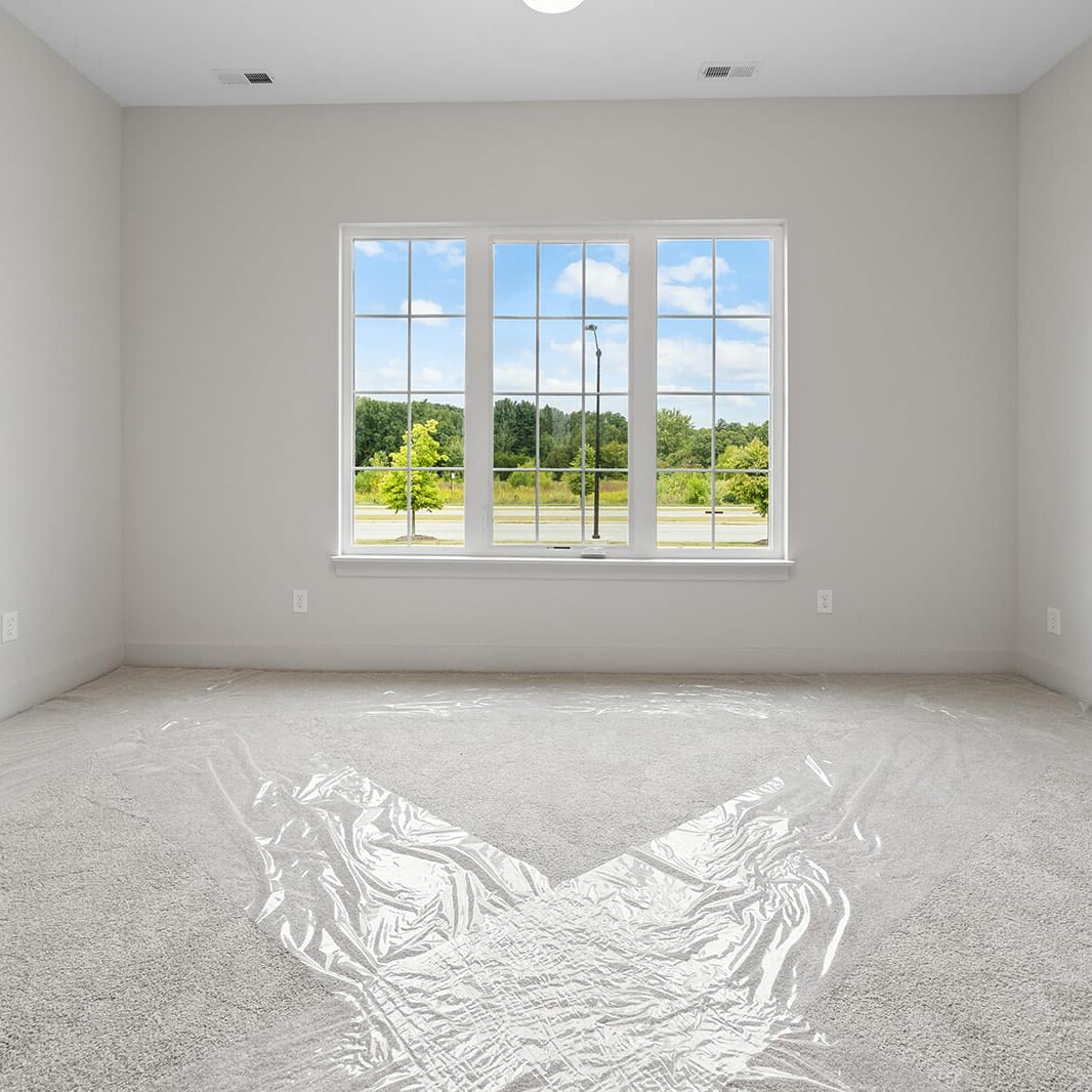 An empty room with a window.