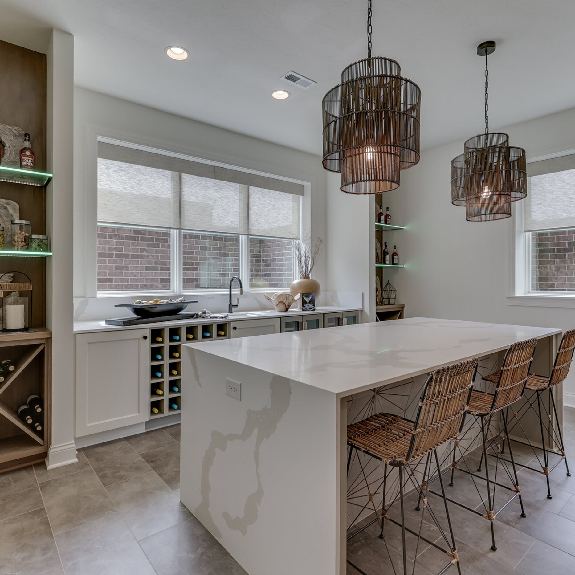 A kitchen with a wine rack and bar stools.